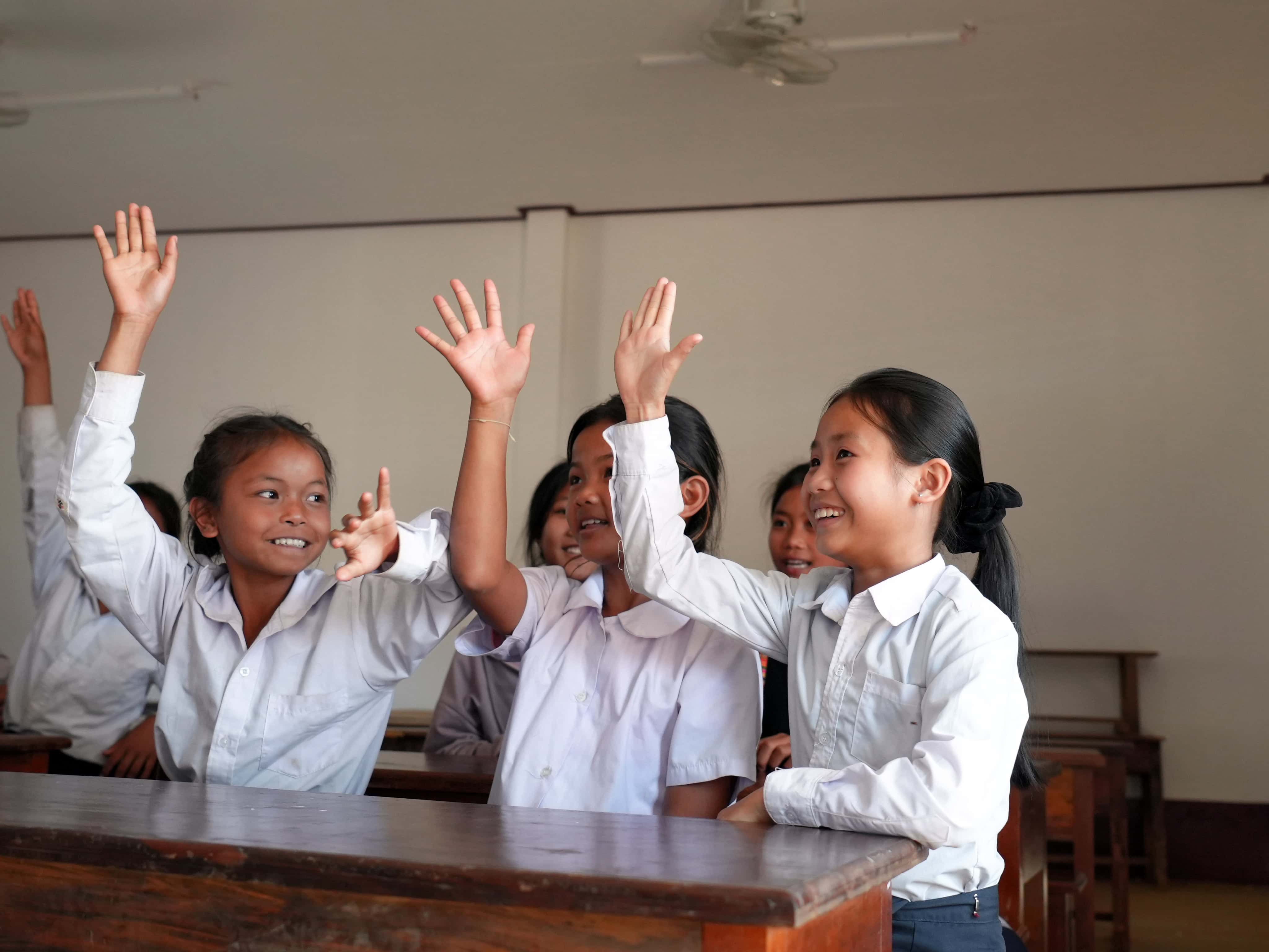 Vankham, 9, and her classmates participate in a lesson at their newly rebuilt primary school in Laos.