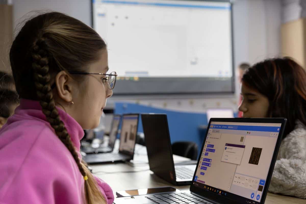 Girls participate in computer classes at a child-friendly space in Kropyvnytskyi, Ukraine.