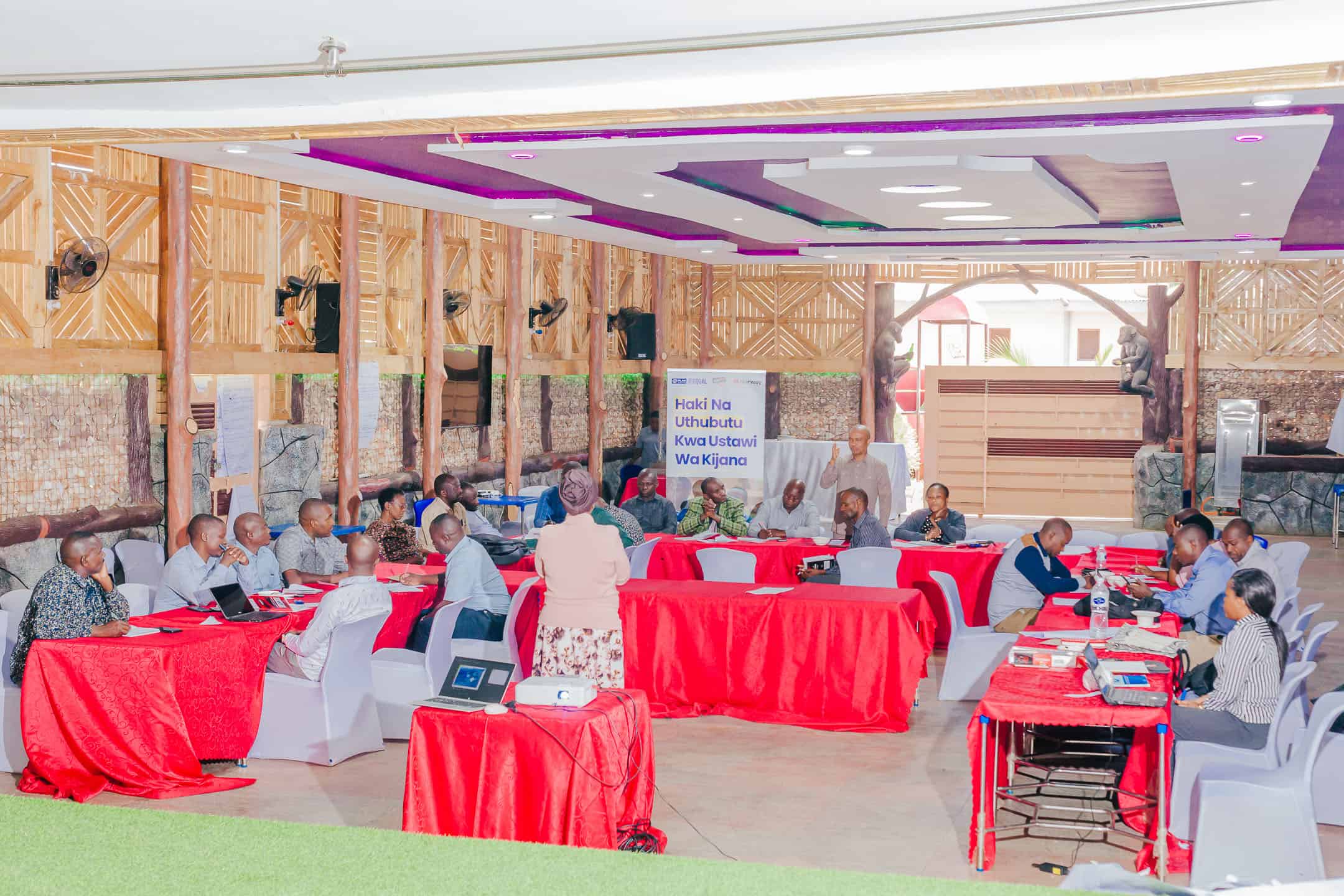 School leaders and education officials participate in a governance training session in Sumbawanga District, Tanzania.